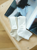 Linen sandals and socks that reveal toes